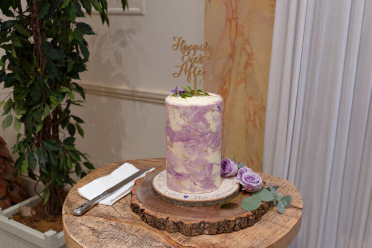 Wedding cake, column style with a purple marbled design