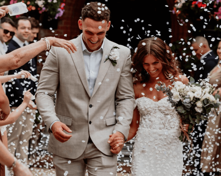 Oliver & Olivia's wedding: Bride and groom in confetti