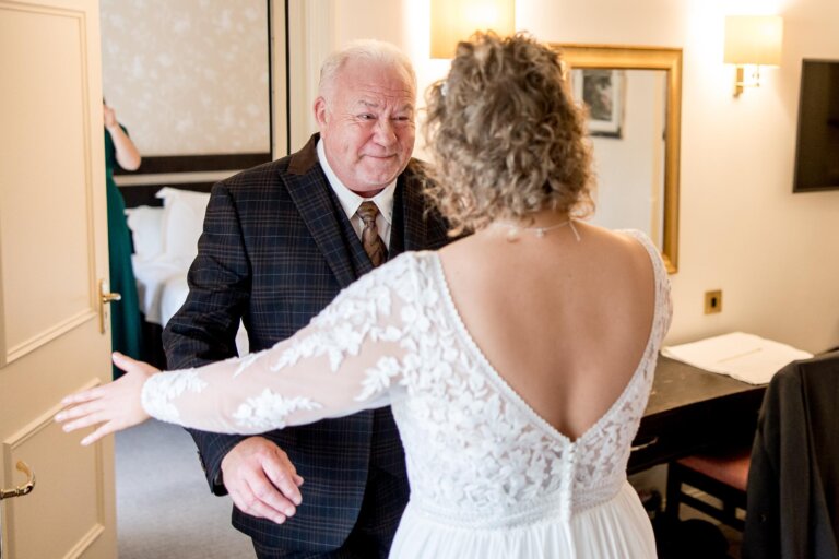 Father of the Bride embraces the bride