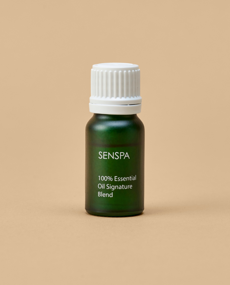 A small green bottle containing SenSpa 100% Essential Oil Signature Blend